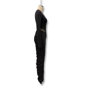 Detail of waist cut-out and elegant ruched texture on this black slim fit maxi dress