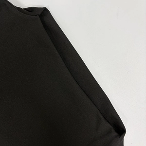 Close-up of the ribbed knit fabric and high-quality stitching on this black dress