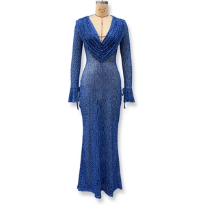 Detail of the V-neckline pleats and animal print on this long sleeve mesh maxi dress