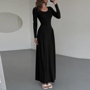 Detail of ruched waist design on an elegant black long sleeve maxi dress with U-neck