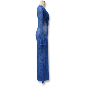 Detail of blue leopard print mesh fabric with flared sleeves on a slim-fit maxi dress