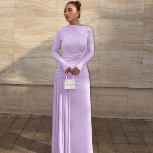 Detail of elegant ruched fabric and slim fit design on a lavender long sleeve maxi dress