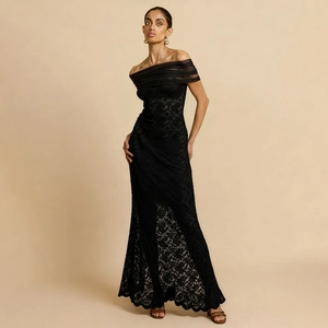 Detail of elegant off-shoulder black lace dress with sheer mesh pleats and slim fit