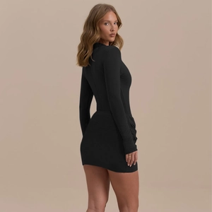 Elegant black long sleeve bodycon mini dress featuring a slim fit and ruching details