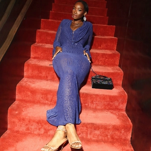 Close-up of blue leopard mesh maxi dress with sheer texture and long flared sleeves