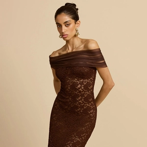 Detailed view of dark brown floral lace texture and pleated mesh on an off-shoulder dress