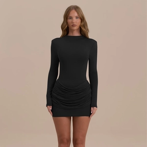 Close-up detail of a black slim fit mini dress with elegant ruched side texture