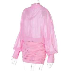 Detail of pink mesh long sleeve top with cuff buttons and ruched mini skirt set