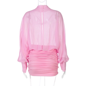 Detail of pink long sleeve ruched dress with sheer mesh top and button back closure