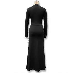 Detailed back view of a black maxi dress featuring elegant waist folds and a sleek silhouette