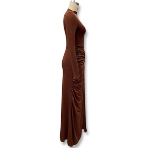 Detail view of the elegant ruched side texture on this dark brown long sleeve dress
