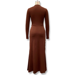 Detail view of the back of a slim fit brown long sleeve dress with mermaid hemline