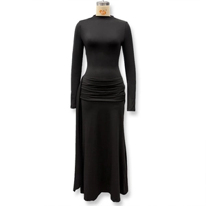 Close-up of black long sleeve bodycon dress featuring elegant waist ruching and side drapes