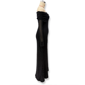 Detail of elegant black off-shoulder maxi dress with sparkling silver mesh and slim fit