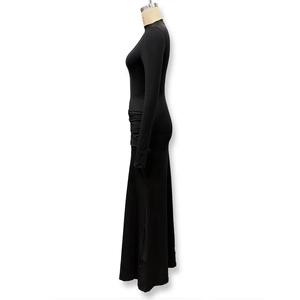 Detail view of the ruched waist design on a slim fit long sleeve black maxi dress