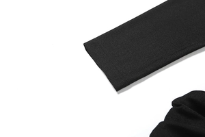 Close-up of black long sleeve cuff showing premium knitted fabric and fine stitching detail