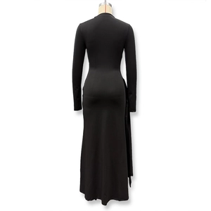 Detail view of the sleek back design on this slim fit long sleeve black maxi dress