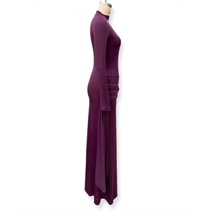 Close-up of elegant deep purple slim fit dress with side pleats and turtleneck detail