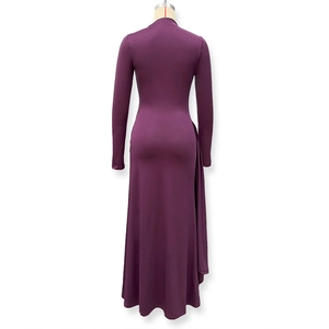 Close-up of the elegant deep purple long-sleeve maxi dress with pleated streamer details