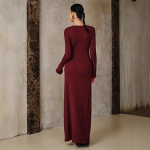 Elegant burgundy long-sleeve maxi dress with a slim fit and stylish metallic details