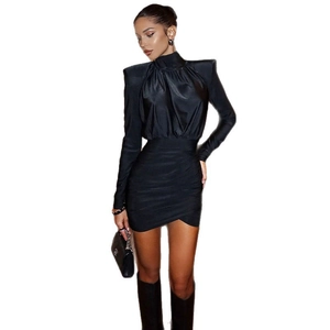 Elegant black high neck long sleeve dress with padded shoulders and ruched bodycon design