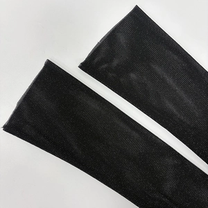 Close-up of semi-transparent black mesh sleeve with fine breathable micro-grid texture