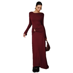 Elegant burgundy long sleeve maxi dress with boat neck and gold metal waist detail