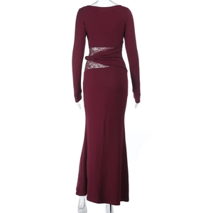 Detail of the back cutout with lace patchwork and twist design on burgundy dress