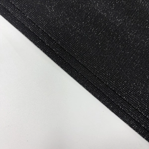 Close-up of black mesh fabric with sparkling silver metallic thread and fine texture