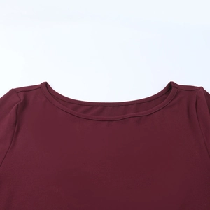 Detail of the crew neckline on this burgundy long sleeve dress with fine stitching