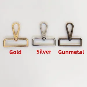 Close-up of swivel lobster clasps in gold silver and gunmetal for adjustable bag straps