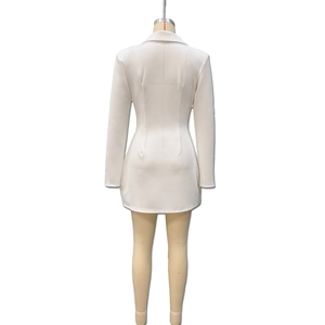 Rear view of white long-sleeved blazer dress featuring a slim fit and tailored back