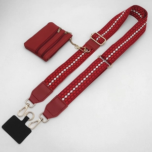 Detailed set of red and white polka dot woven strap with matching leather coin purse and gold hooks