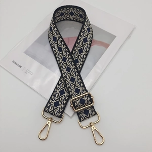 Adjustable geometric diamond jacquard wide shoulder strap with gold hardware hooks