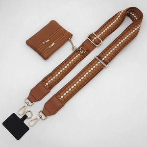 Adjustable brown polka dot woven phone strap with small zipper pouch and gold metal hardware