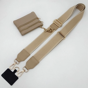 Detail view of khaki nylon phone strap with a zipper coin pouch and gold metal hardware