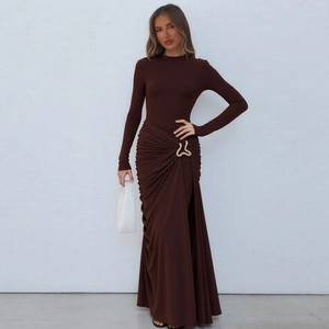 Detail of coffee brown dress featuring ruched draping and a gold metal ring ornament