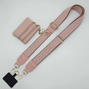 Adjustable pink patterned shoulder strap with matching coin purse and phone connector