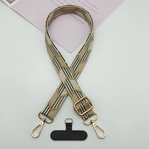 Adjustable jacquard weave shoulder strap with black arrow patterns and gold hardware