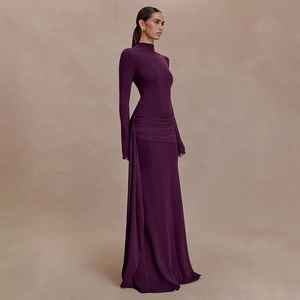 Detail view of waist ruched layers and elegant draping on this dark purple maxi dress