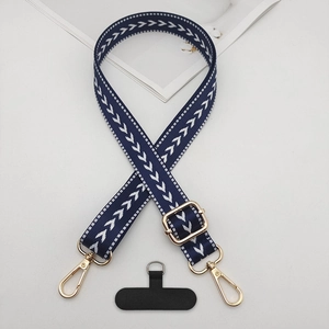 Adjustable dark blue braided crossbody phone strap with white herringbone pattern and gold clips