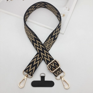 Adjustable woven phone strap with zigzag pattern, gold metal hooks and black pad
