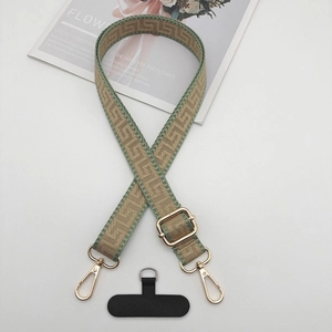 Adjustable green and beige jacquard phone strap with gold hooks and tether tab