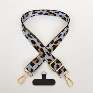 Adjustable leopard print polyester phone lanyard with gold lobster hooks in off-white
