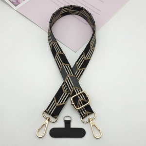 Detail of adjustable woven phone strap with geometric pattern and gold metal lobster clasps