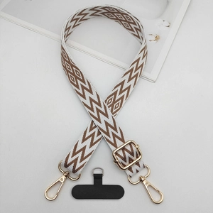 Close-up of adjustable chevron woven strap with gold metal buckles and phone pad