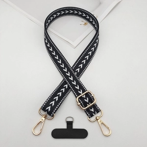 Close-up of woven arrow pattern phone strap with luxury gold metal lobster clasps
