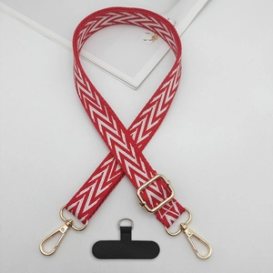 Detail of red and white herringbone woven phone strap with gold metal swivel hook and pad