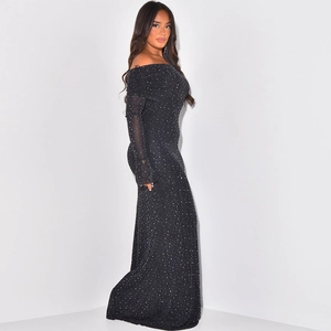 Detail of elegant off-shoulder black dress with shimmering silver glitter and slim-fit waist