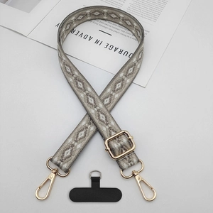 Ethnic jacquard phone strap with gold metal buckles and black connector patch details